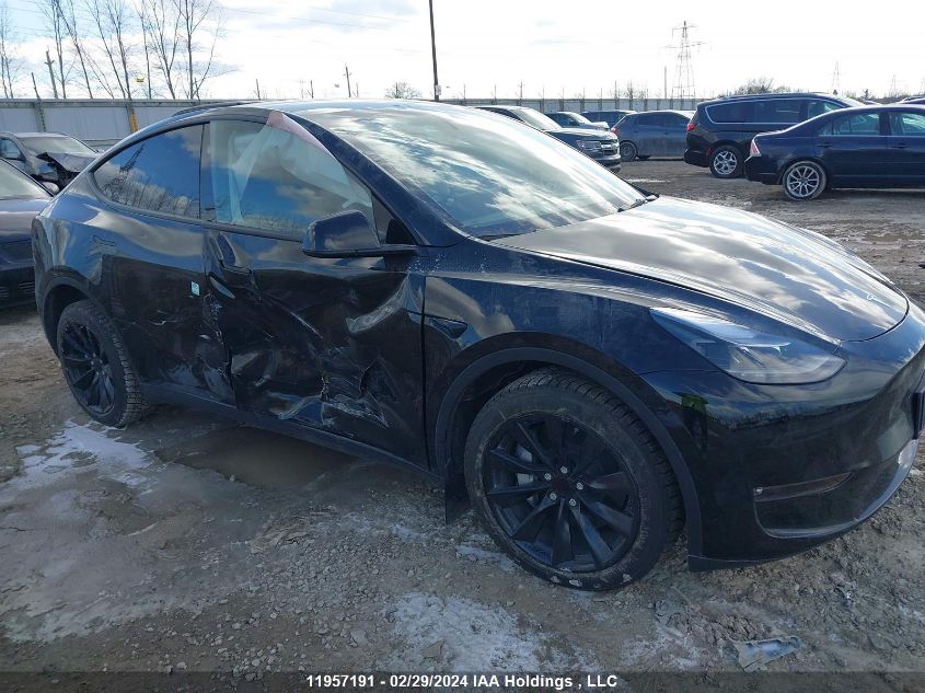 2024 Tesla Model Y VIN: 7SAYGDEE4RF989335 Lot: 11957191