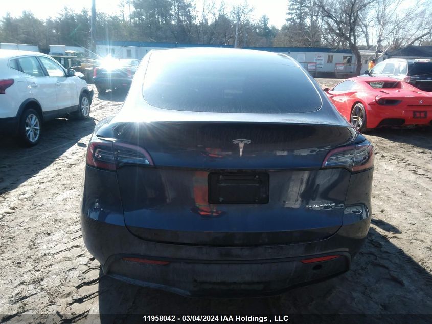 2023 Tesla Model Y VIN: 7SAYGAEE0PF607118 Lot: 11958042