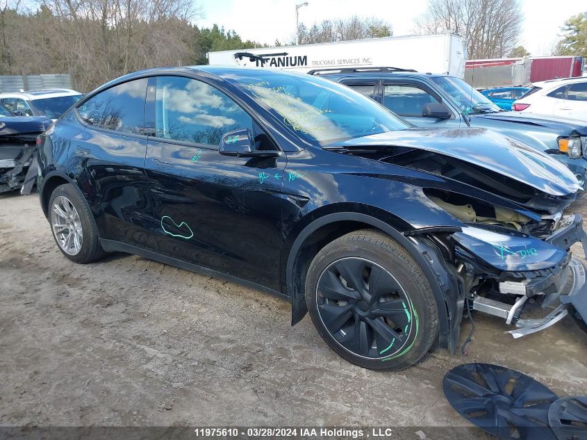 2023 Tesla Model Y VIN: LRWYGDFD7PC967713 Lot: 11975610