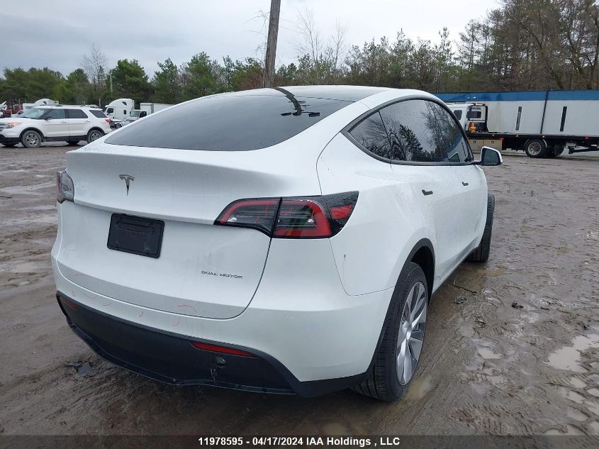 2023 Tesla Model Y VIN: LRWYGDEE1PC162588 Lot: 11978595