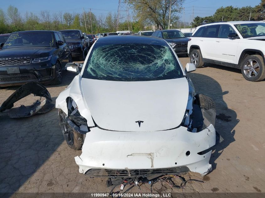 2022 Tesla Model 3 VIN: 5YJ3E1EB2NF128702 Lot: 11990947