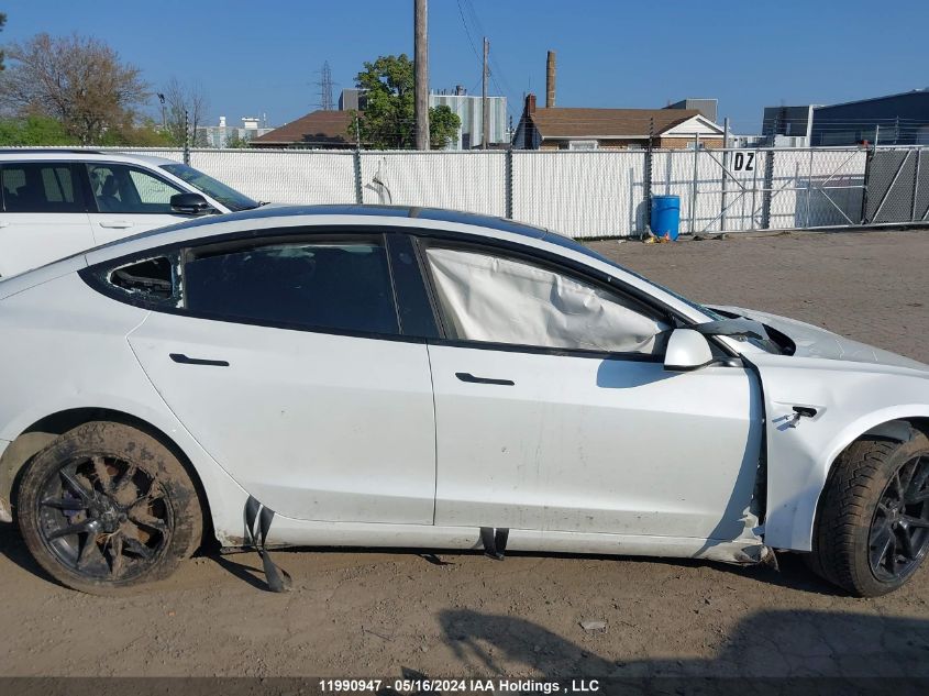 2022 Tesla Model 3 VIN: 5YJ3E1EB2NF128702 Lot: 11990947