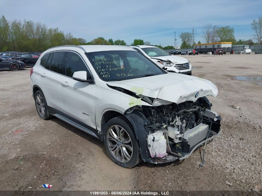 2017 BMW X1 VIN: WBXHT3C31H5F68490 Lot: 11991003