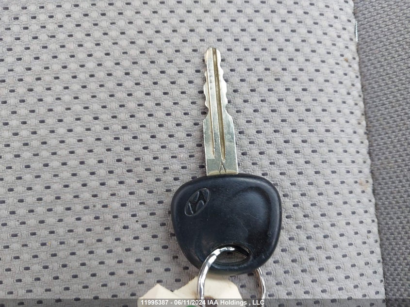 2007 Hyundai Accent VIN: KMHCN45C57U161094 Lot: 11995387