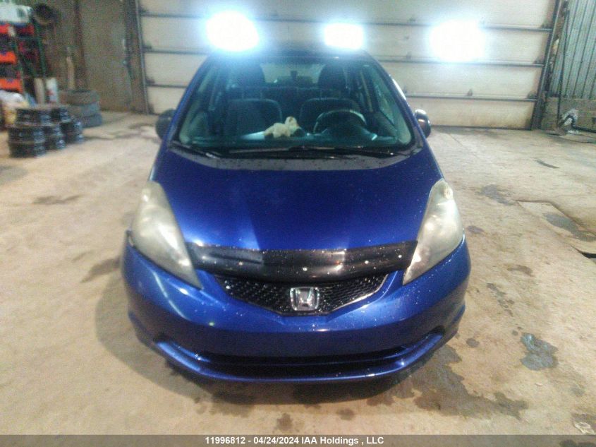 2009 Honda Fit Dx-A VIN: JHMGE87329S808235 Lot: 11996812