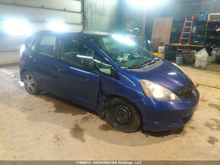 2009 Honda Fit Dx-A VIN: JHMGE87329S808235 Lot: 11996812