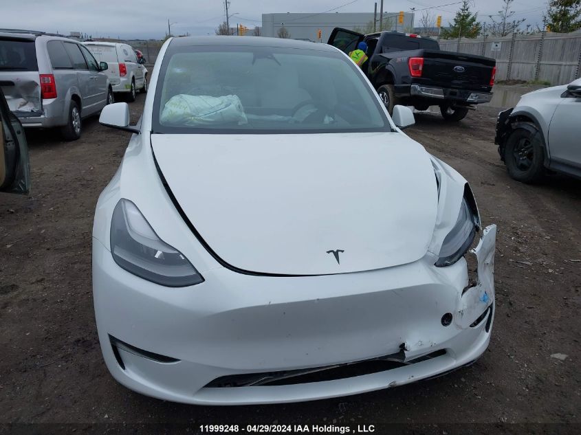 2022 Tesla Model Y VIN: 7SAYGDEFXNF440693 Lot: 11999248