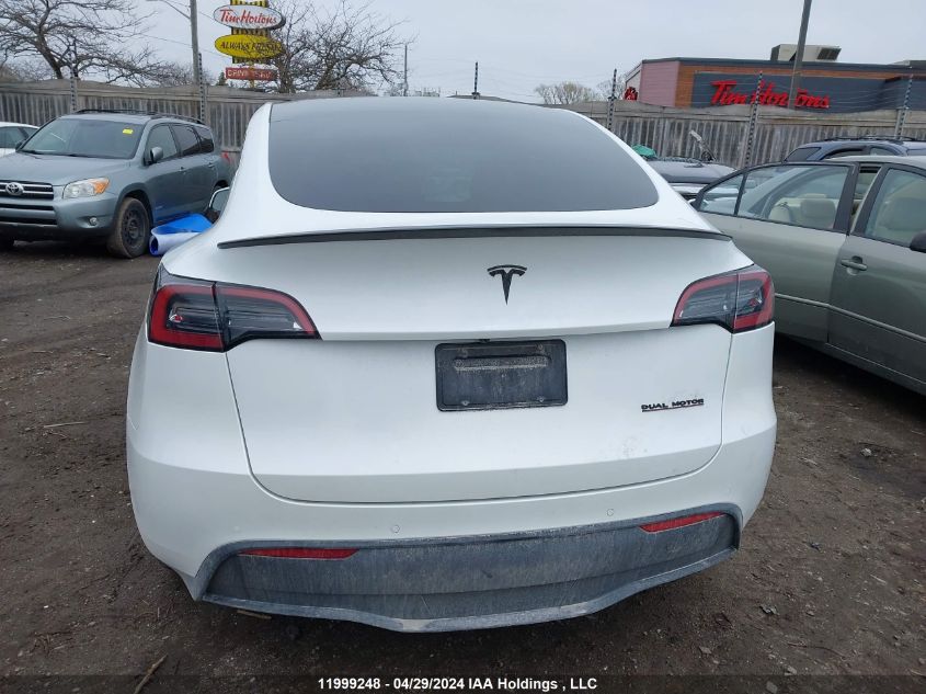 2022 Tesla Model Y VIN: 7SAYGDEFXNF440693 Lot: 11999248