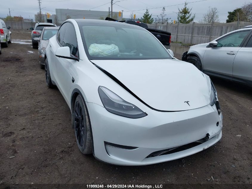 2022 Tesla Model Y VIN: 7SAYGDEFXNF440693 Lot: 11999248