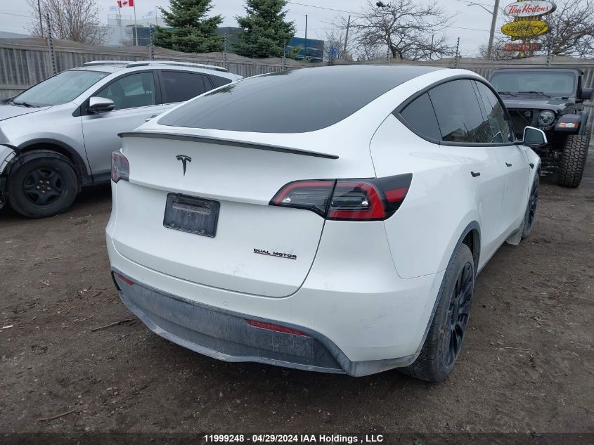 2022 Tesla Model Y VIN: 7SAYGDEFXNF440693 Lot: 11999248