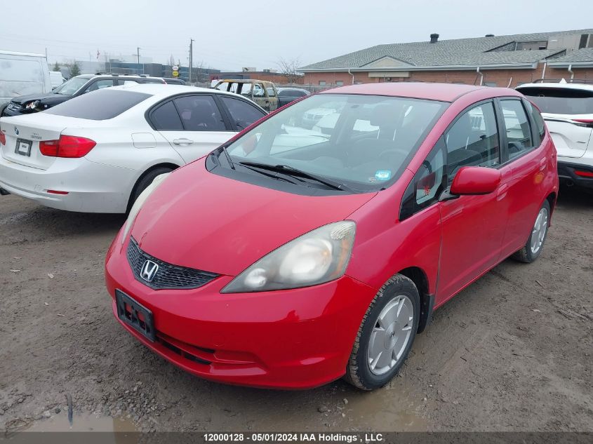 2009 Honda Fit VIN: JHMGE88559S812974 Lot: 12000128