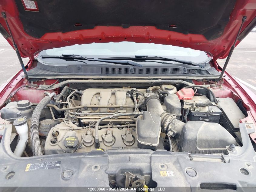 2014 Ford Taurus Sel VIN: 1FAHP2E8XEG106677 Lot: 12000860