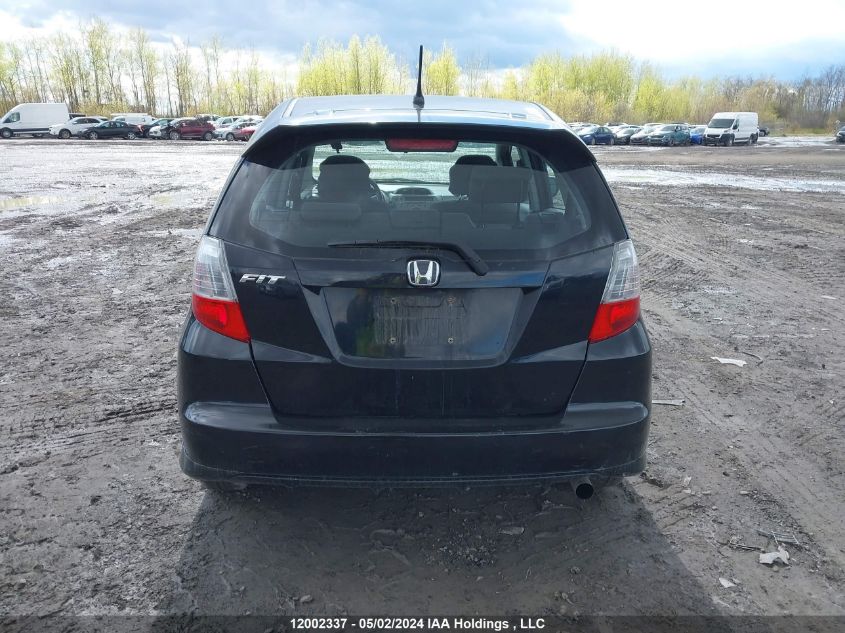 2009 Honda Fit VIN: JHMGE88509S811957 Lot: 12002337
