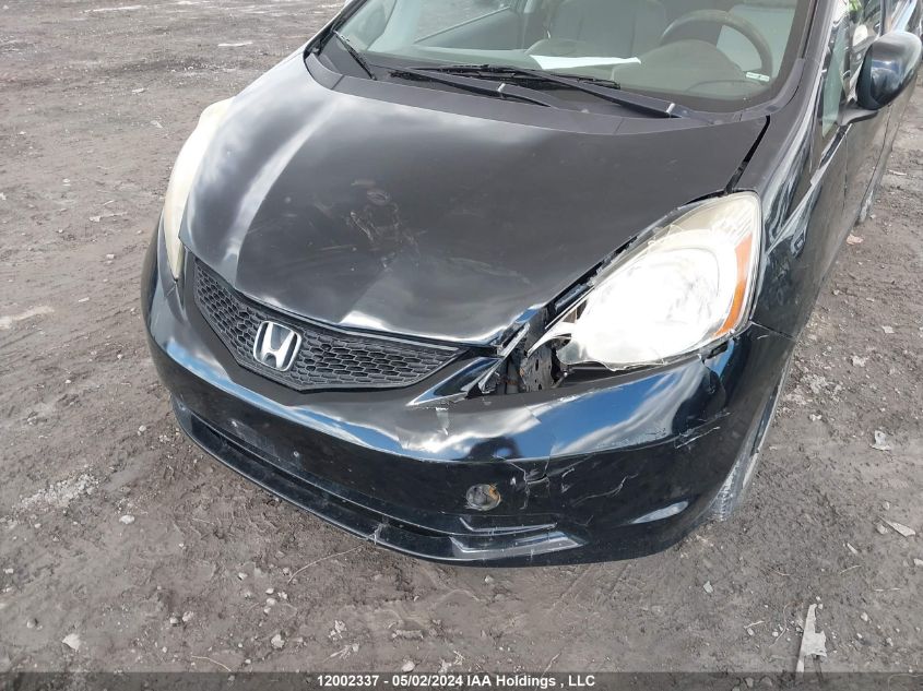 2009 Honda Fit VIN: JHMGE88509S811957 Lot: 12002337