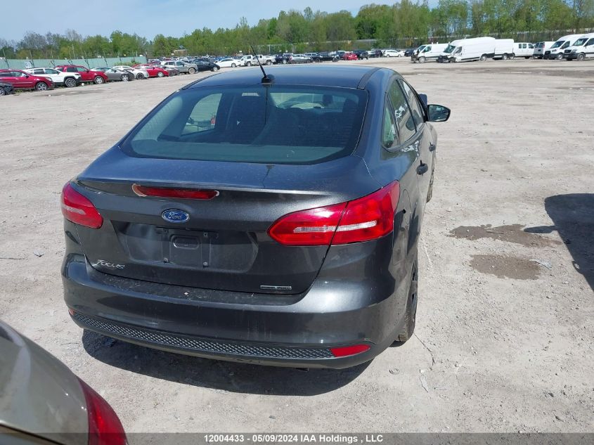 2015 Ford Focus VIN: 1FADP3E22FL296614 Lot: 12004433