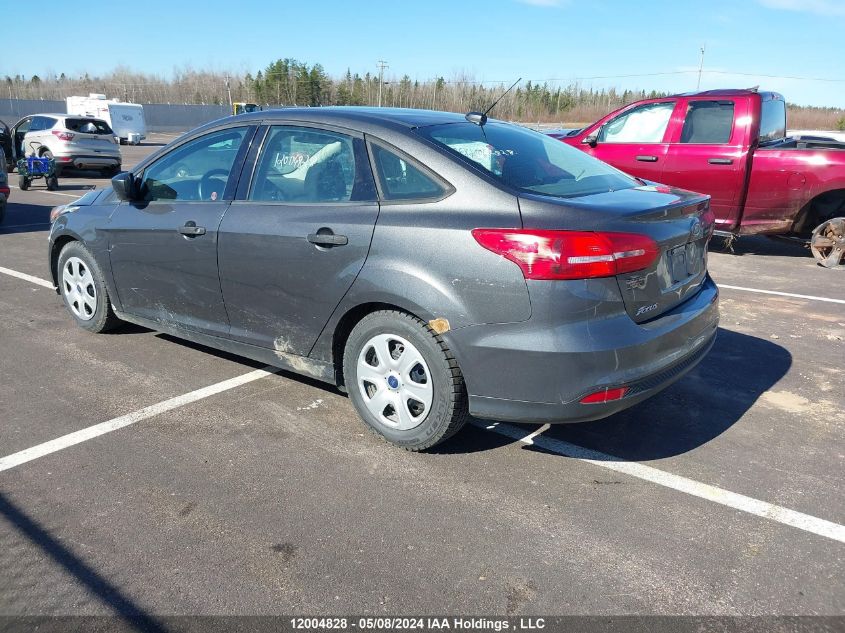 2015 Ford Focus S VIN: 1FADP3E28FL371252 Lot: 12004828