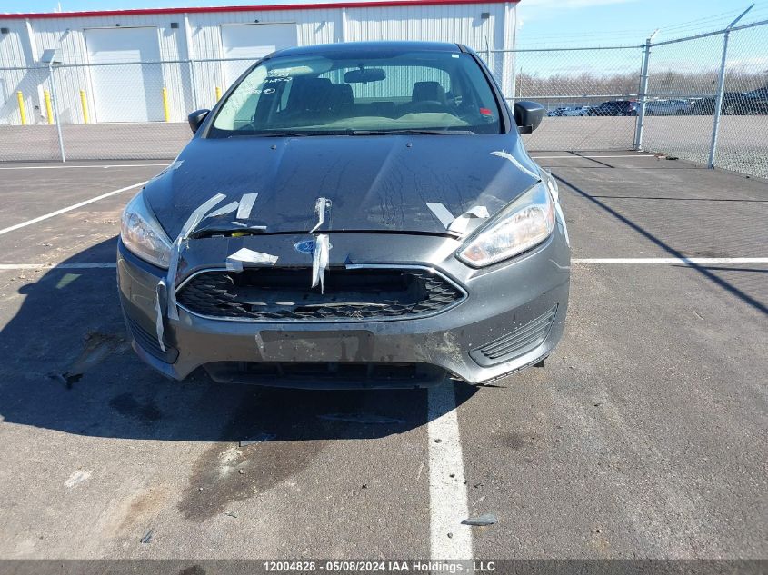 2015 Ford Focus S VIN: 1FADP3E28FL371252 Lot: 12004828