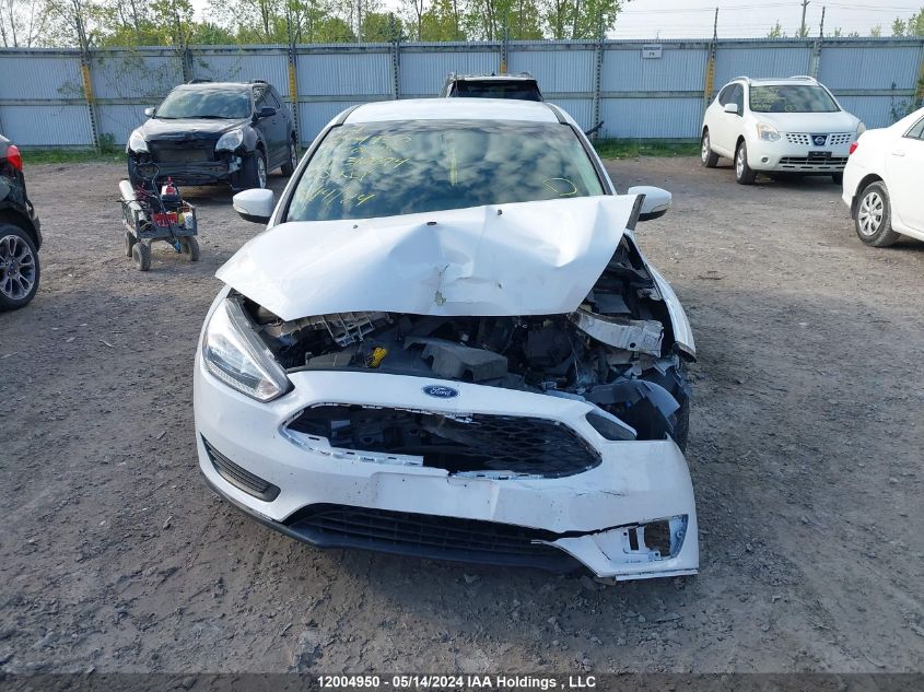 2017 Ford Focus Se VIN: 1FADP3K20HL310694 Lot: 12004950