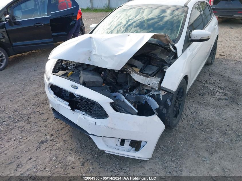 2017 Ford Focus Se VIN: 1FADP3K20HL310694 Lot: 12004950