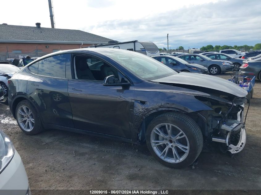 2024 Tesla Model Y VIN: 7SAYGDED0RF015021 Lot: 12009015