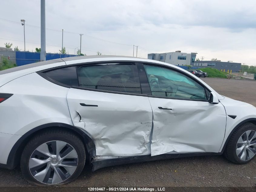 2023 Tesla Model Y VIN: LRWYGDFD7PC966657 Lot: 12010467