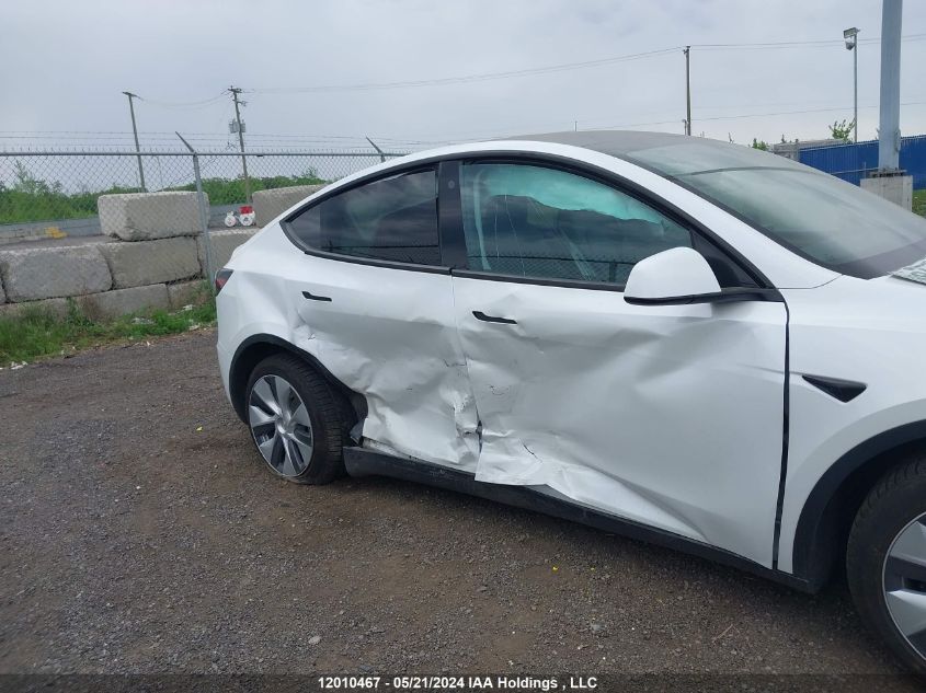 2023 Tesla Model Y VIN: LRWYGDFD7PC966657 Lot: 12010467