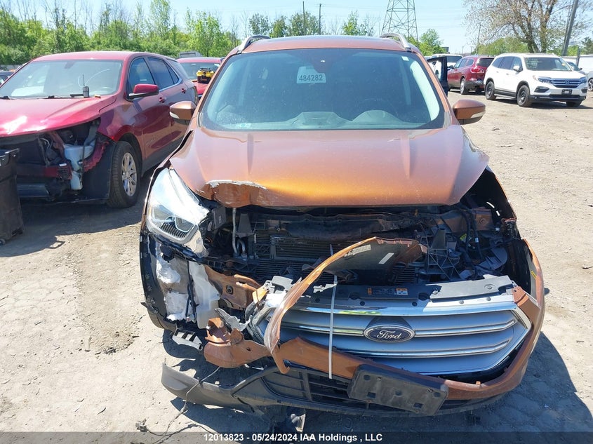 2017 Ford Escape Titanium VIN: 1FMCU9J94HUE99856 Lot: 12013823