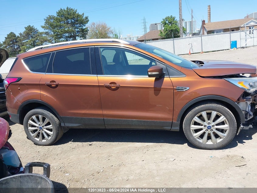 2017 Ford Escape Titanium VIN: 1FMCU9J94HUE99856 Lot: 12013823