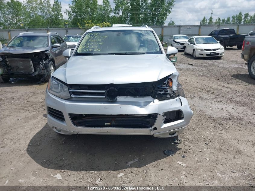 2014 Volkswagen Touareg VIN: WVGEP9BP7ED007166 Lot: 12019279