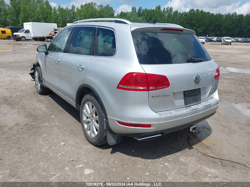 2014 Volkswagen Touareg VIN: WVGEP9BP7ED007166 Lot: 12019279