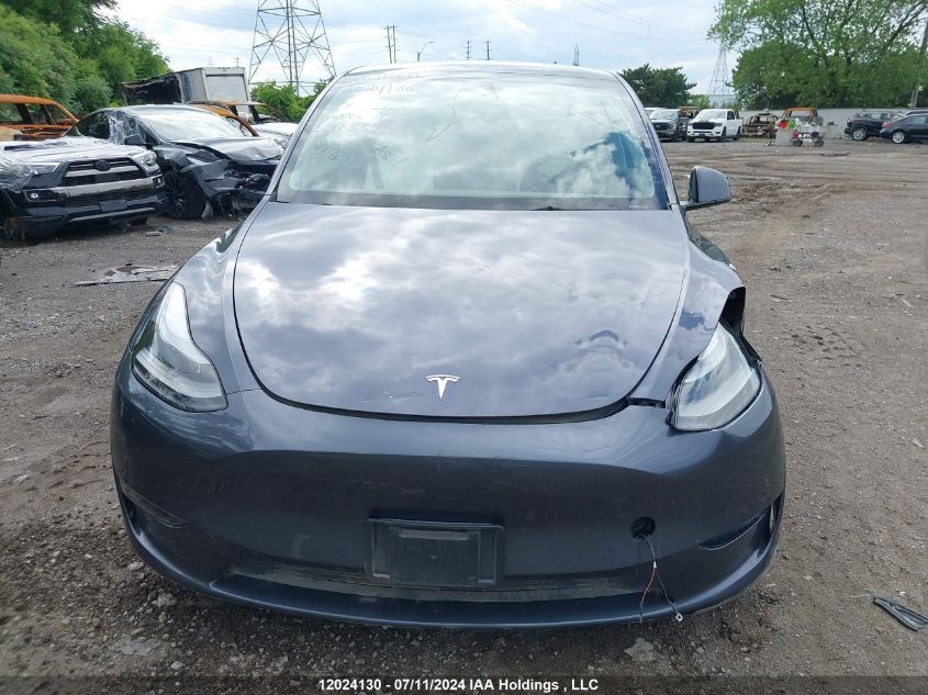 2023 Tesla Model Y VIN: 7SAYGDEE0PF641559 Lot: 12024130