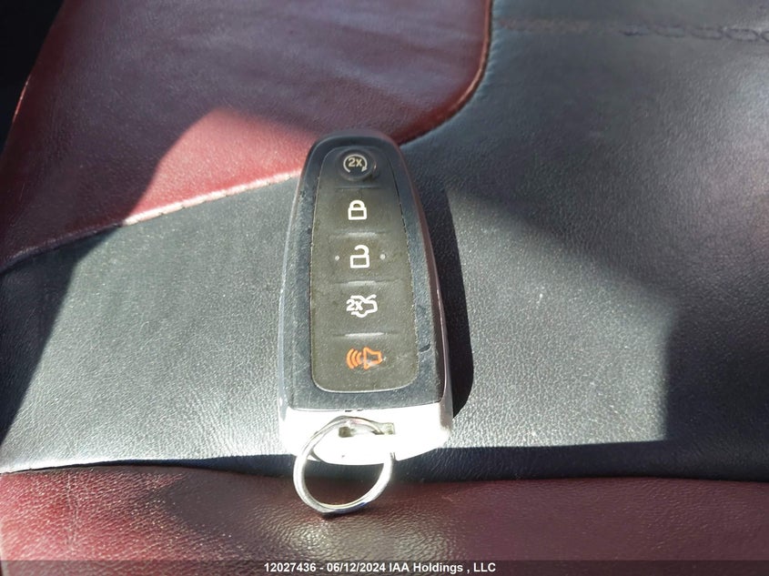 2014 Ford Focus Titanium VIN: 1FADP3J26EL242771 Lot: 12027436