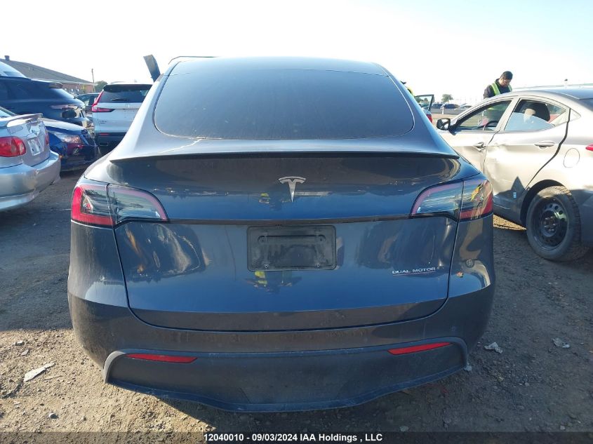 2023 Tesla Model Y VIN: 7SAYGDEF4PF591192 Lot: 12040010