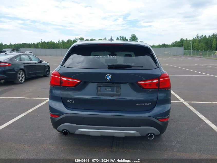 2018 BMW X1 VIN: WBXHT3C31J3H32936 Lot: 12040944