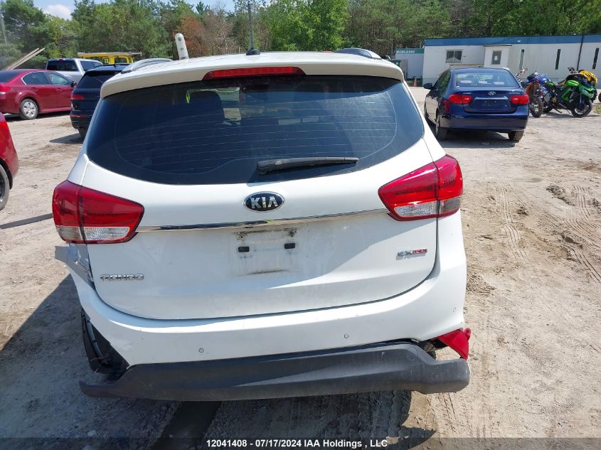 2014 Kia Rondo VIN: KNAHU8A3XE7054111 Lot: 12041408