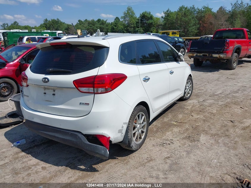 2014 Kia Rondo VIN: KNAHU8A3XE7054111 Lot: 12041408