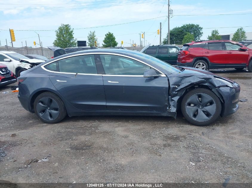 2019 Tesla Model 3 VIN: 5YJ3E1EA0KF411313 Lot: 12048125