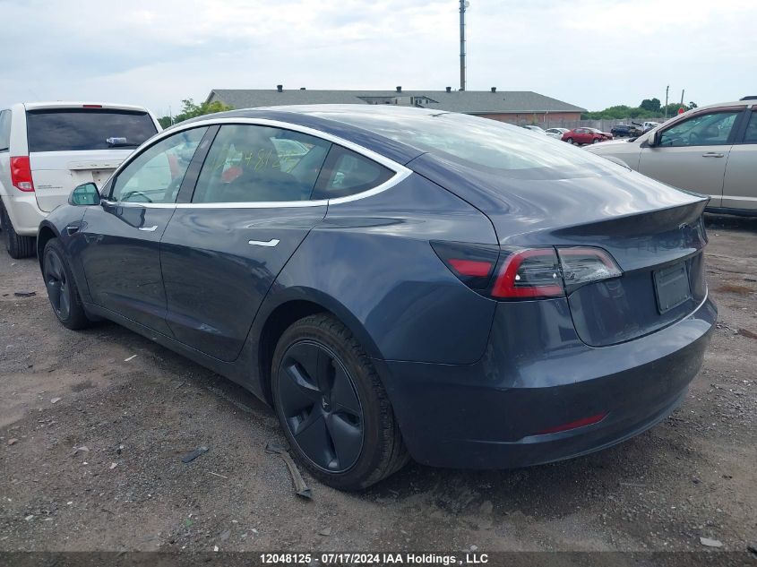 2019 Tesla Model 3 VIN: 5YJ3E1EA0KF411313 Lot: 12048125