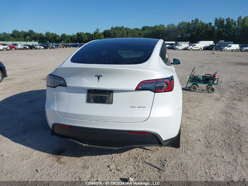 2023 Tesla Model Y VIN: LRWYGDEEXPC071996 Lot: 12049315