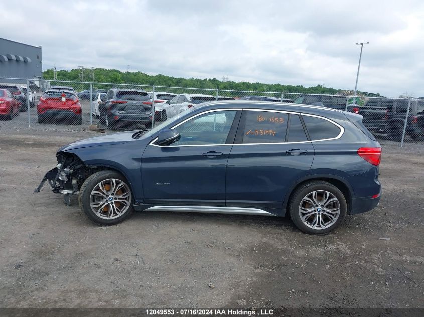 2018 BMW X1 xDrive28I VIN: WBXHT3C31J5K31594 Lot: 12049553