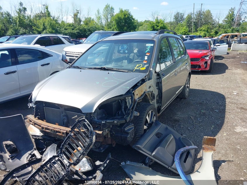 2010 Kia Rondo VIN: KNAHH8C82A7309325 Lot: 12050034