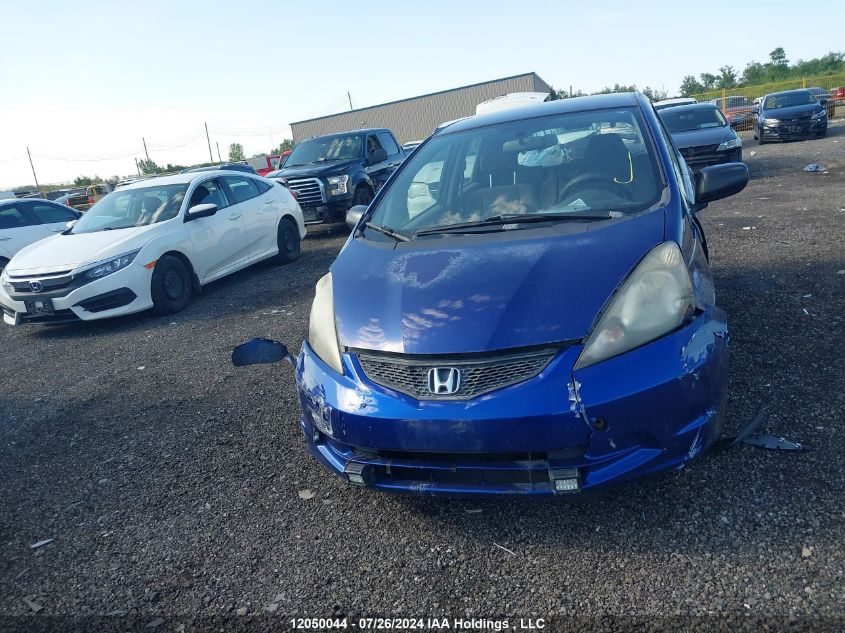 2009 Honda Fit VIN: JHMGE87319S802703 Lot: 12050044