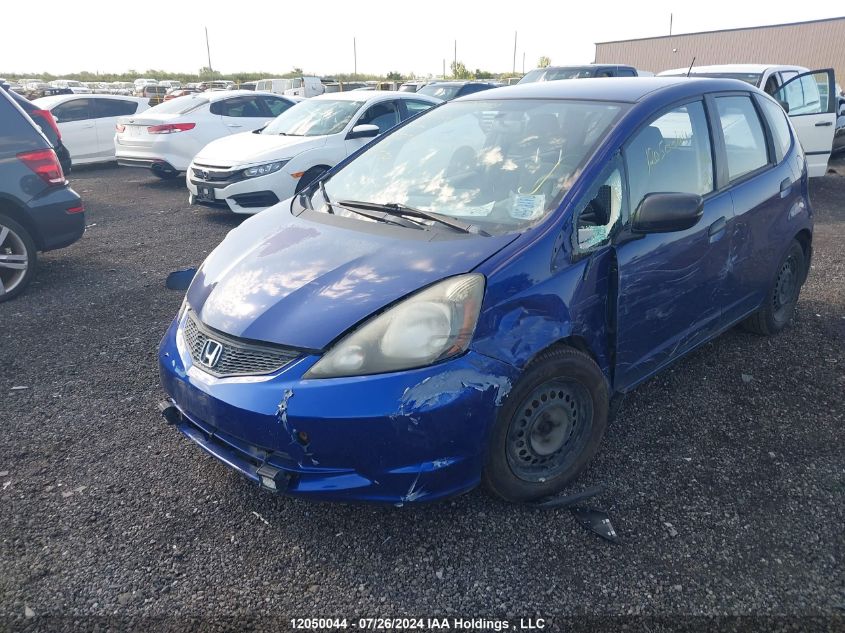 2009 Honda Fit VIN: JHMGE87319S802703 Lot: 12050044