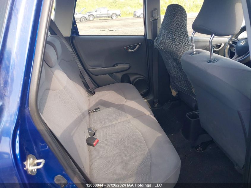 2009 Honda Fit VIN: JHMGE87319S802703 Lot: 12050044