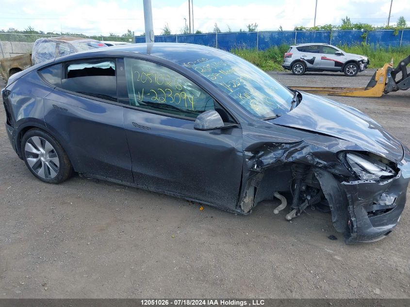 2023 Tesla Model Y VIN: LRWYGDFD0PC223094 Lot: 12051026