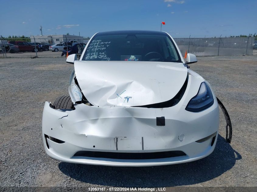 2022 Tesla Model Y VIN: 7SAYGDEE4NF338989 Lot: 12053187