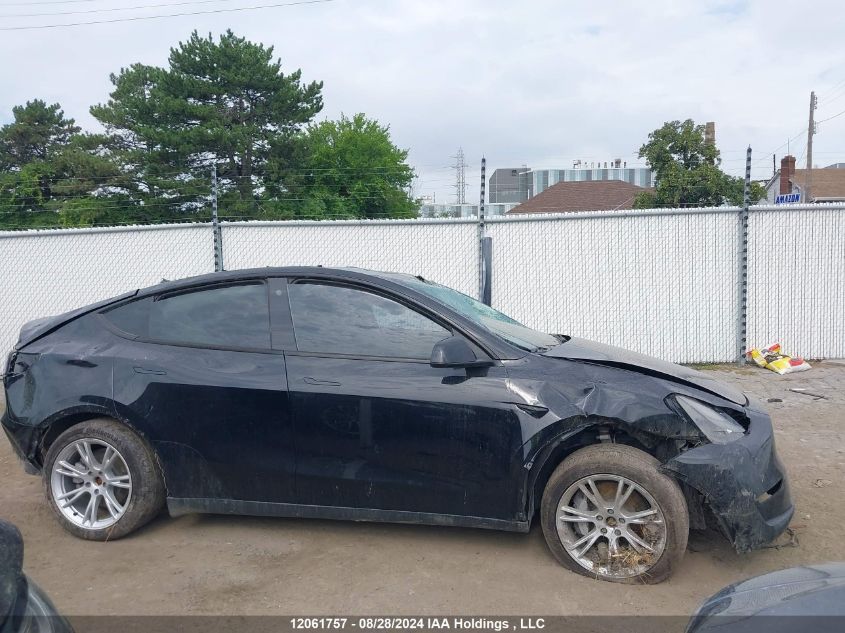 2023 Tesla Model Y VIN: 7SAYGDEE8PF781942 Lot: 12061757