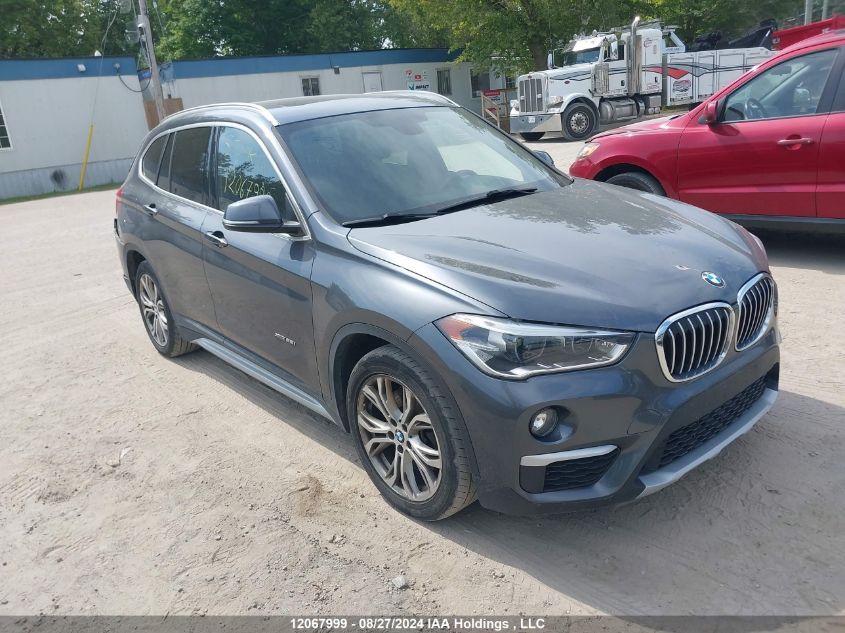 WBXHT3C38G5E54307 2016 BMW X1 - Image 1