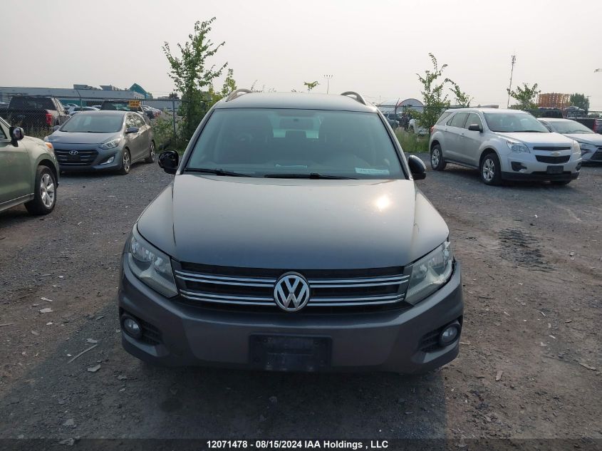 2014 Volkswagen Tiguan VIN: WVGHV3AX8EW579014 Lot: 12071478