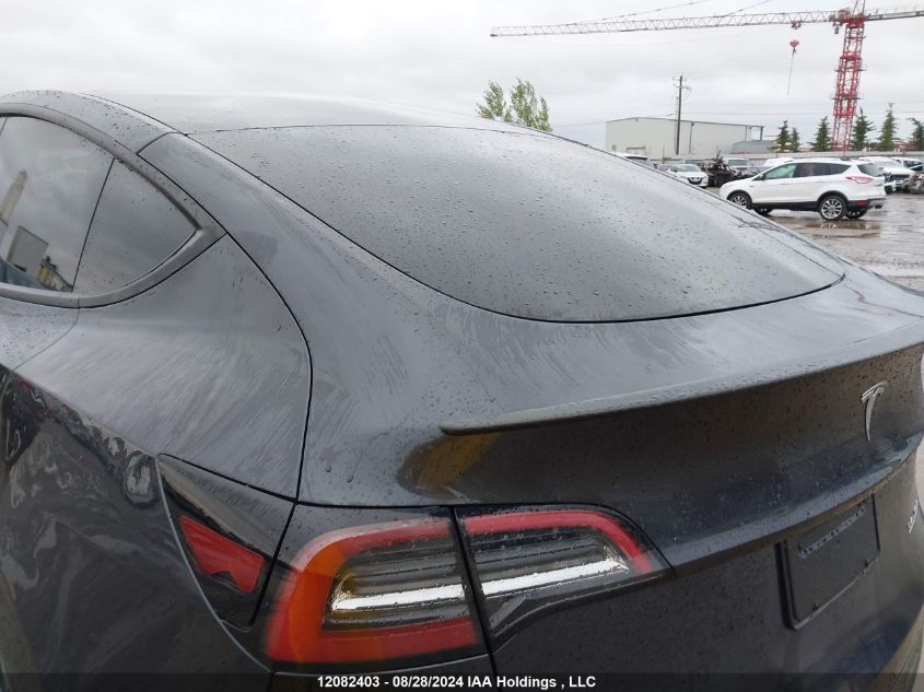 2024 Tesla Model Y VIN: 7SAYGDEF2RF107748 Lot: 12082403